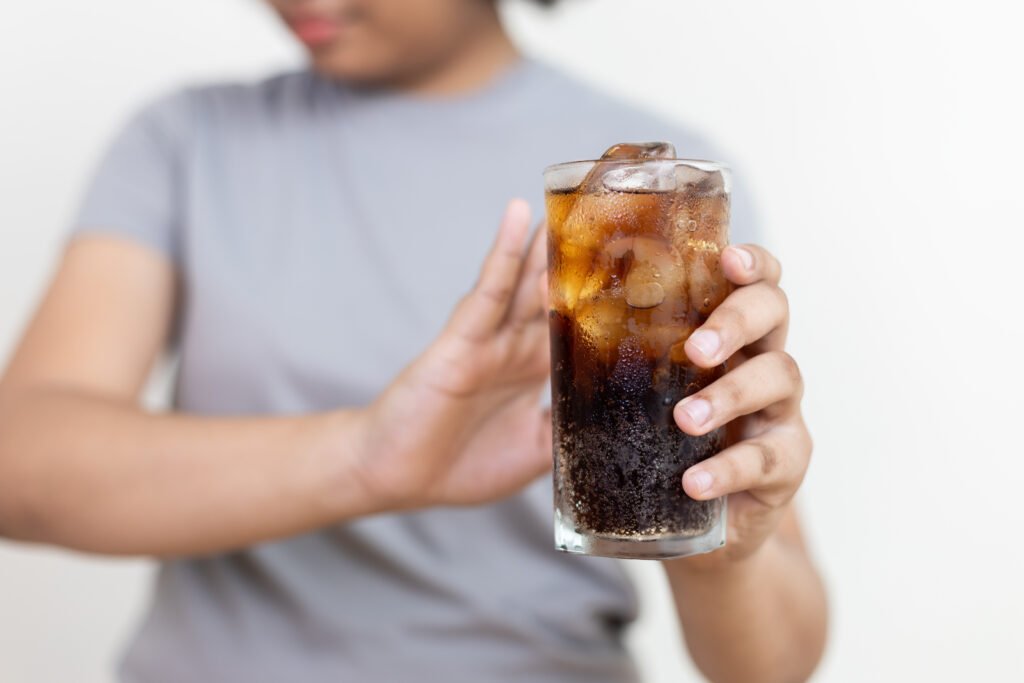 Close up sweet drink, Dieting healthy concept, lose weight. A man rejecting the sugary drink.