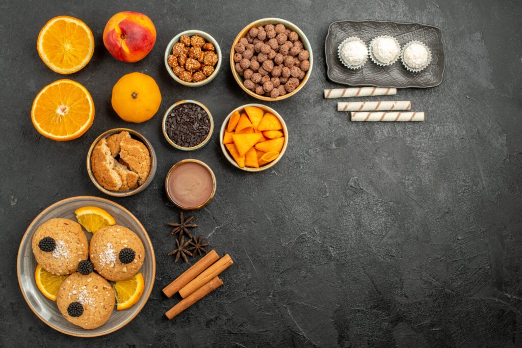 top-view-of-dessert-for-diabetics-sand-cookies-with-orange-slices-and-diffe-