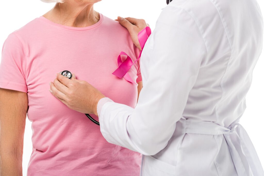 cropped shot of doctor with stethoscope checking health of senior woman