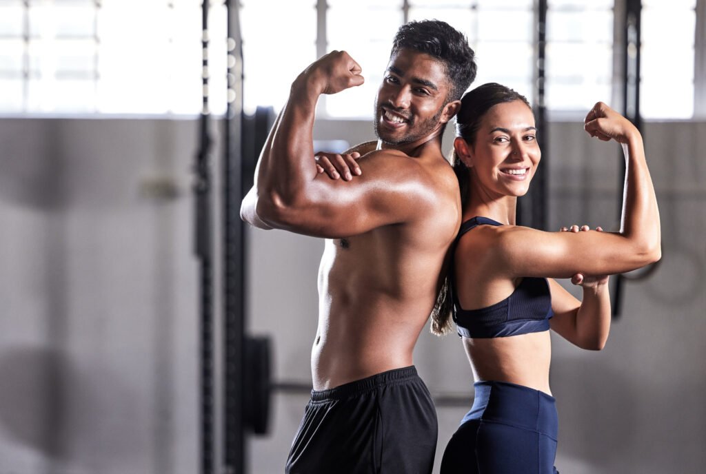 physically Fitn, flexing muscles and strong couple goals while doing exercise or training in a gym. 