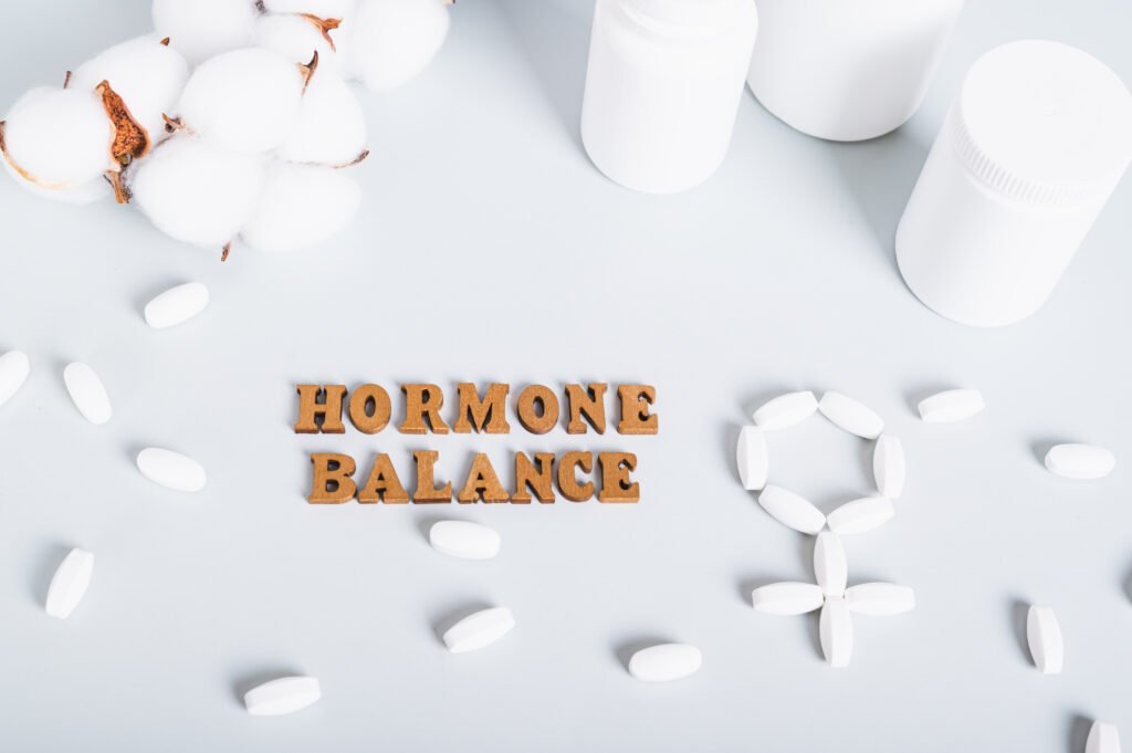 Food supplements for restoring hormonal balance on a blue background