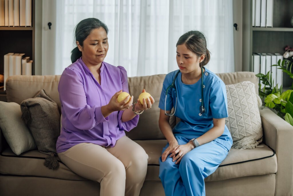 As caregiver, physiotherapist empowers elderly patient at home by educating, guiding, supporting rehabilitation via exercises to improve health care, including strengthening, flexibility, mobility that assist in recovery.